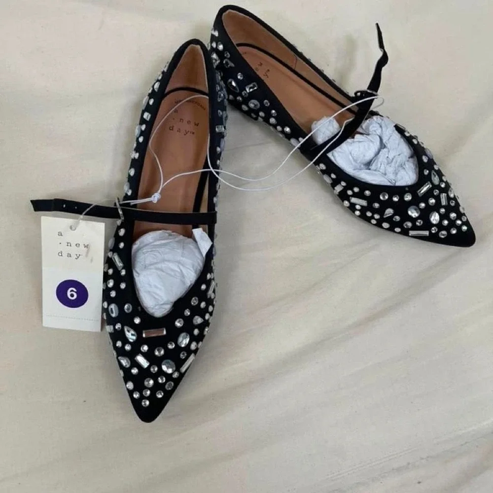 Black ballet flats with silver rhinestones and crystal embellishments